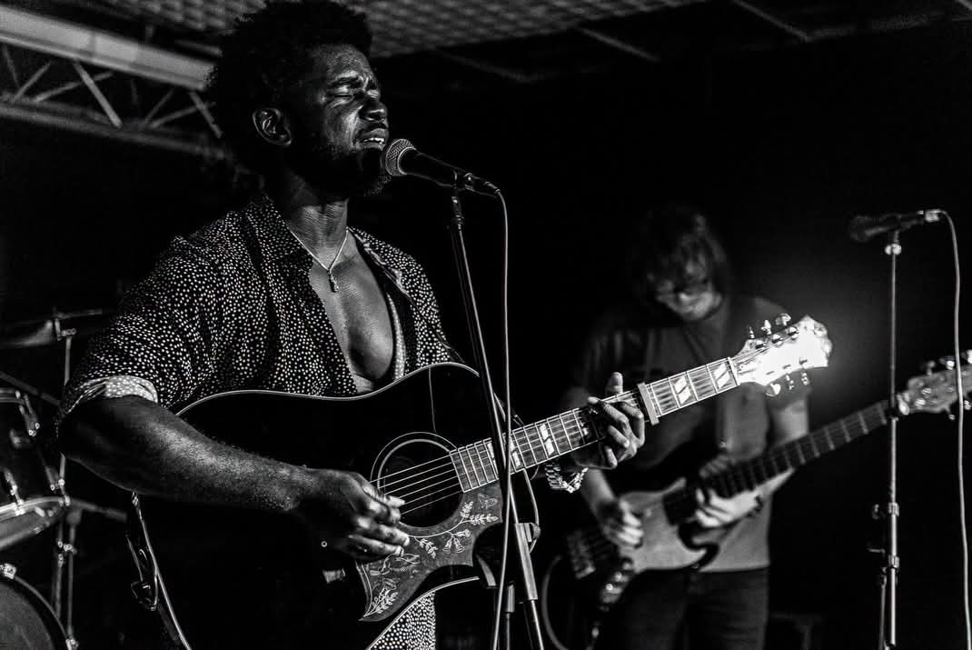 Francis Bondd performing on stage